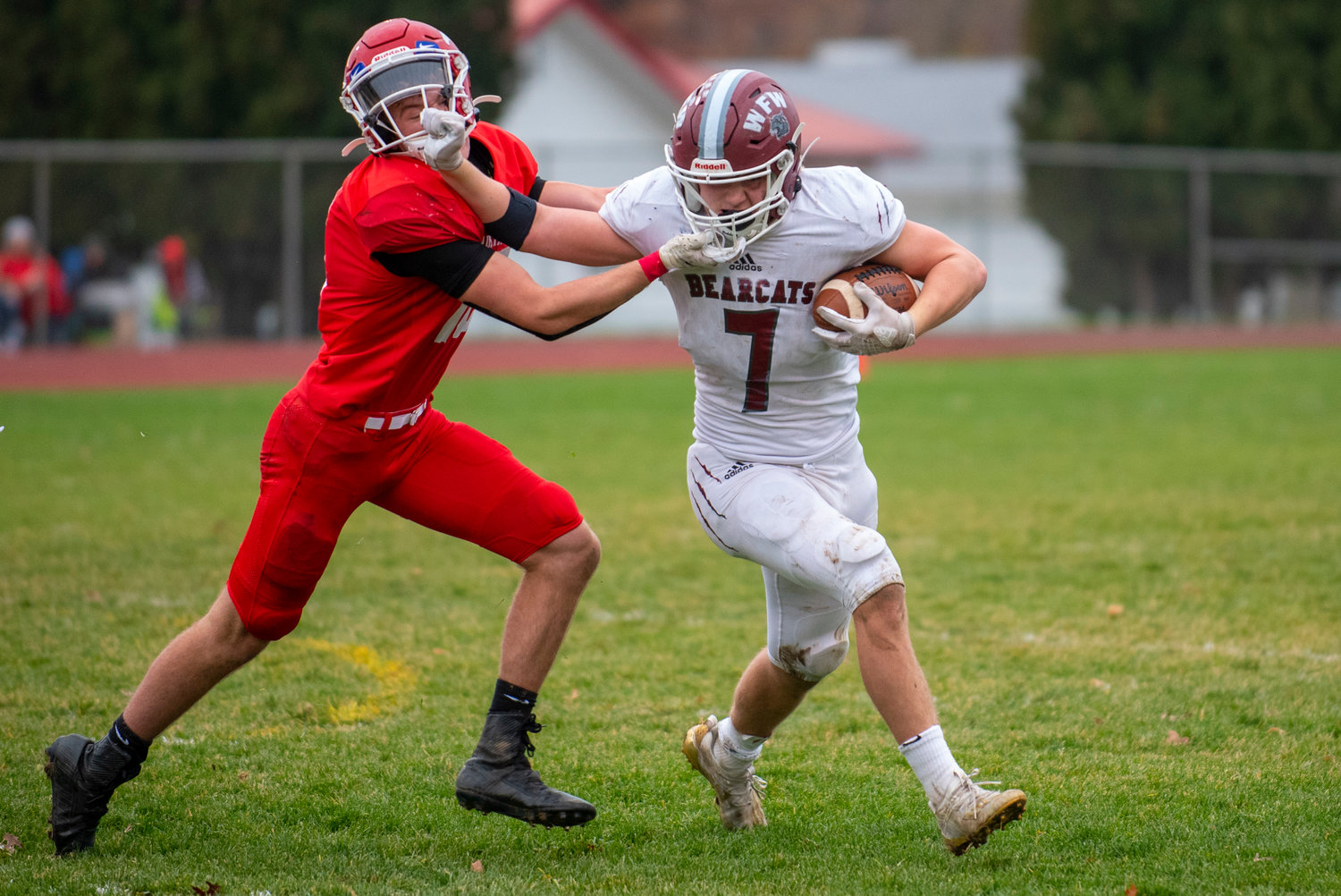W.F. West running back Brock Guyette (7) stiff-arms a Prosser defender during the Bearcats’ state playoff game against the Mustangs on Saturday in Prosser.