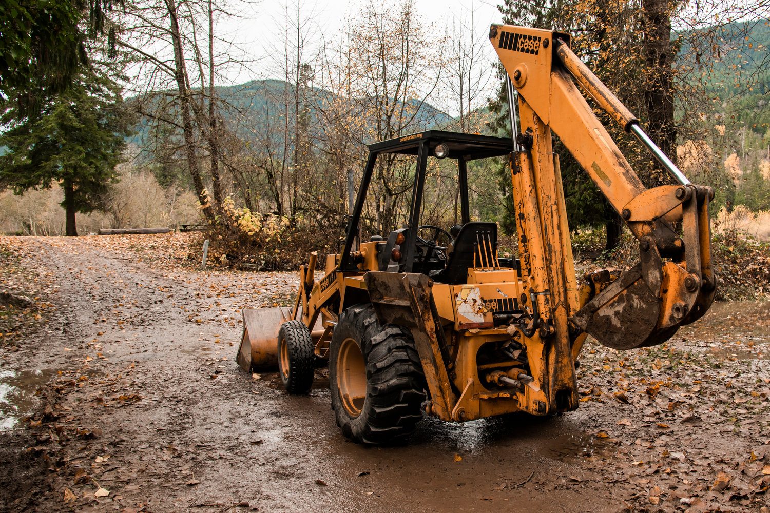 An excavator is seen abandoned at Cascade Peak Campground in Randle after floodwaters rendered the vehicle in operable while assisting nearby campers.