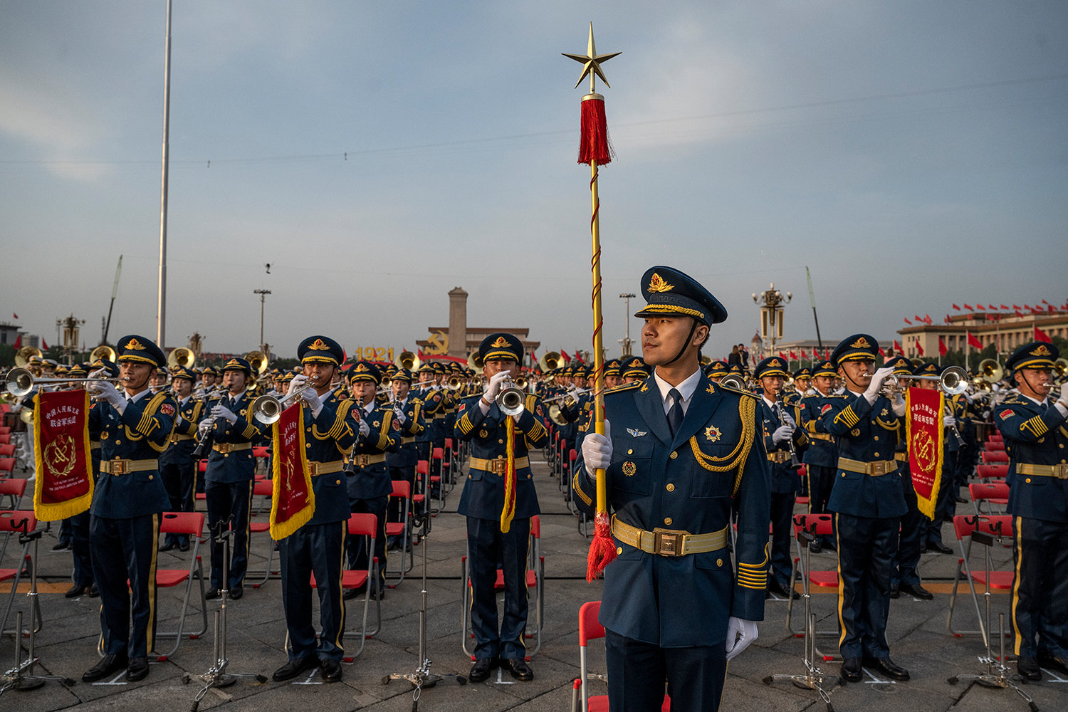 A Chinese military band conductor stands in front of band members at a ceremony marking the 100th anniversary of the Communist Party on July 1, 2021 at Tiananmen Square in Beijing, China. (Kevin Frayer/Getty Images/TNS)