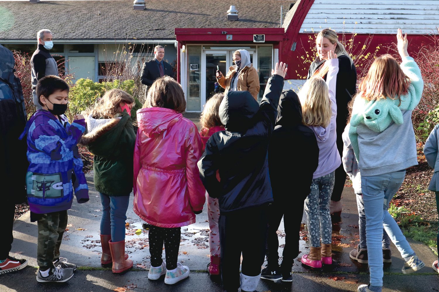 Oakville Elementary students, mediated by Oakville Elementary School Principal Jessica Swift, ask questions about the school district’s plans to demolish and reconstruct the elementary school at a groundbreaking ceremony held outside the elementary school on Monday.
