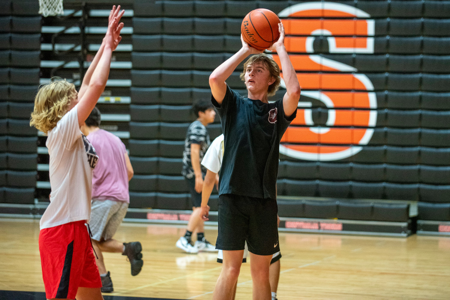 Centralia sophomore Cohen Ballard shoots while Von Wasson puts his hands up during practice Tuesday.