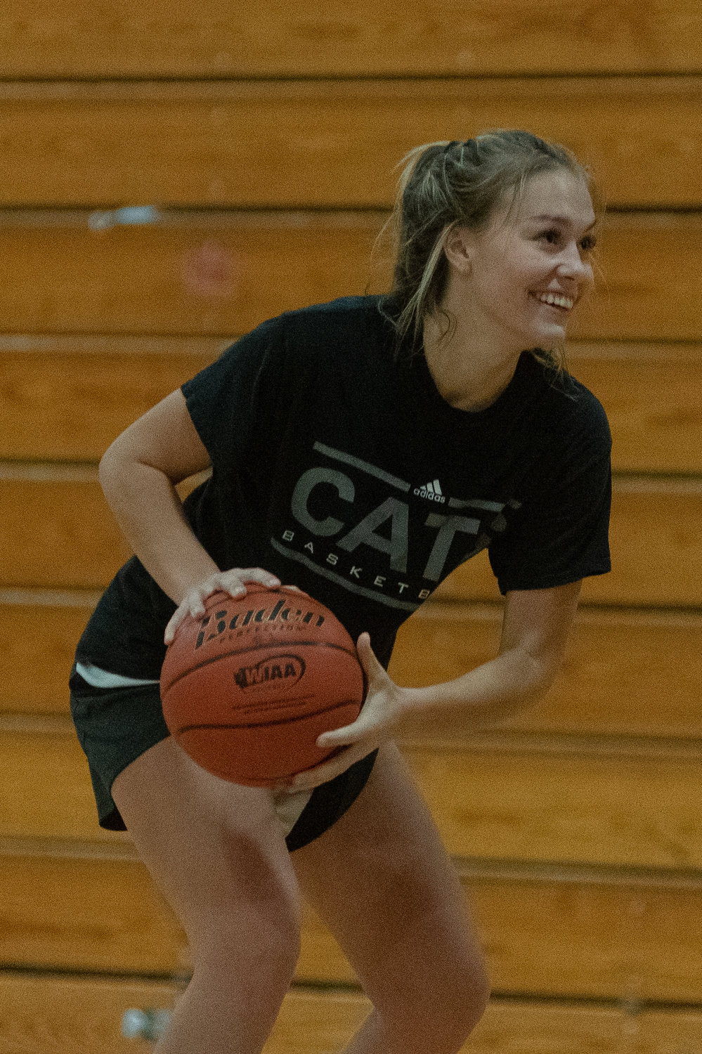 W.F. West guard Kyla McCallum smiles during a drill on the first day of practice Nov. 15.