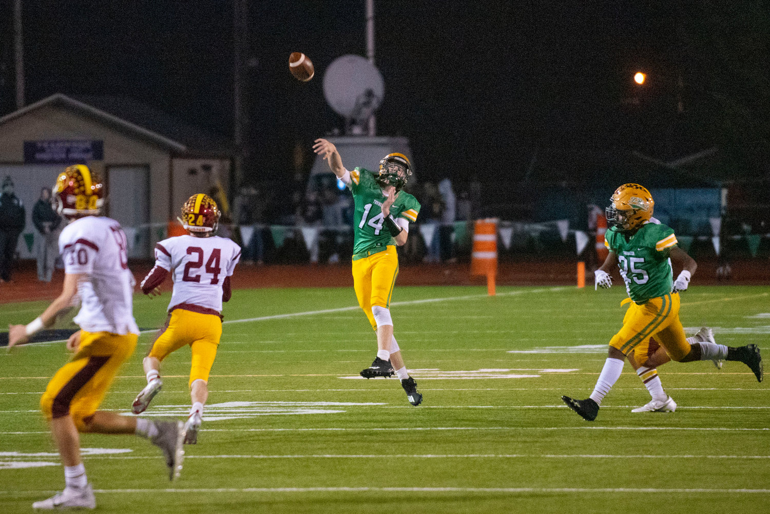 Tumwater quarterback Alex Overbay (14) tosses a pass downfield against Enumclaw Nov. 19.