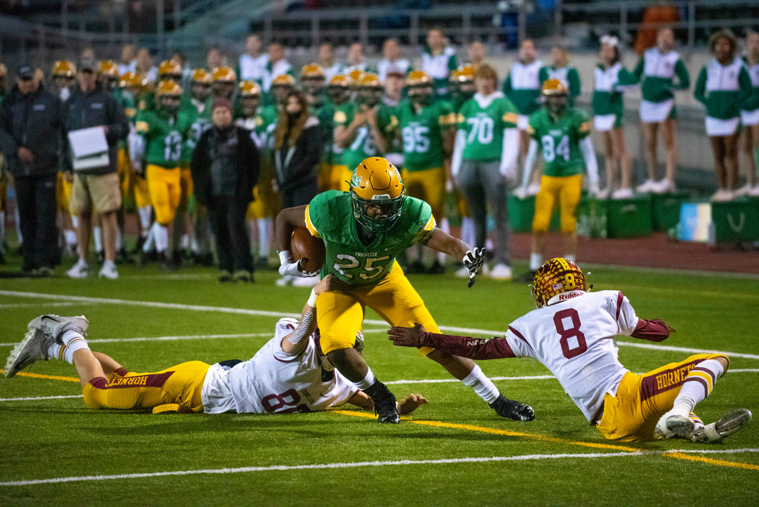 Tumwater halfback Carlos Matheney (25) evades to Enumclaw defenders during the 2A state quarterfinals Nov. 19.