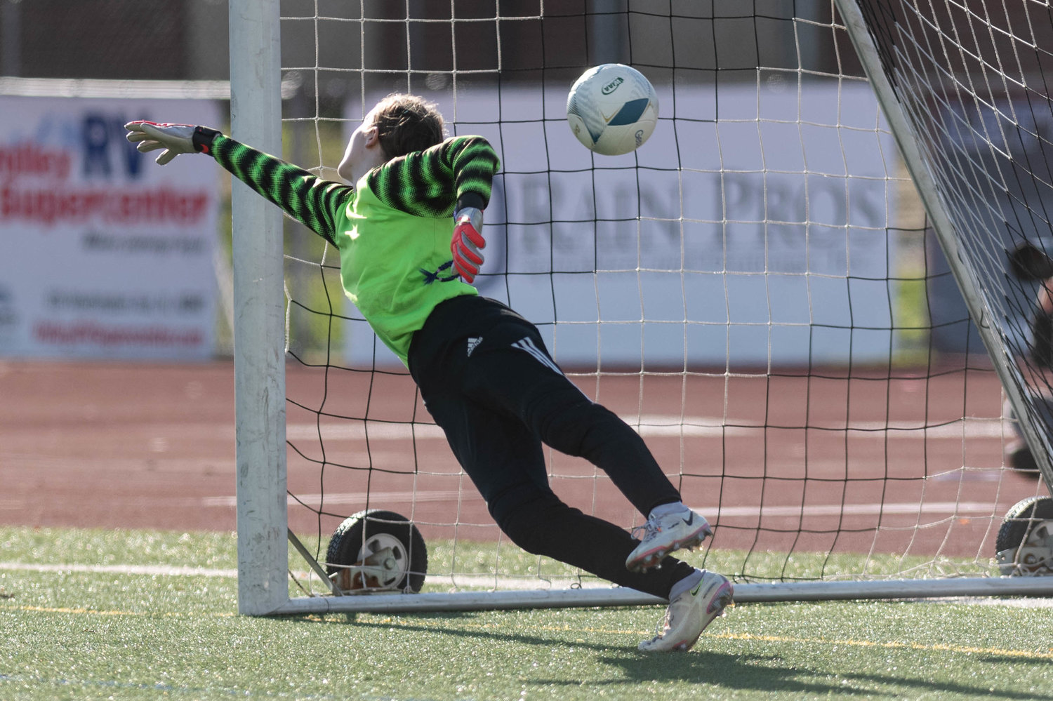 Toledo goalkeeper Daphnie Bybee just misses on a save during the penalty shootout against Highland in the 2B state third-place game at Sunset Stadium Nov. 20.