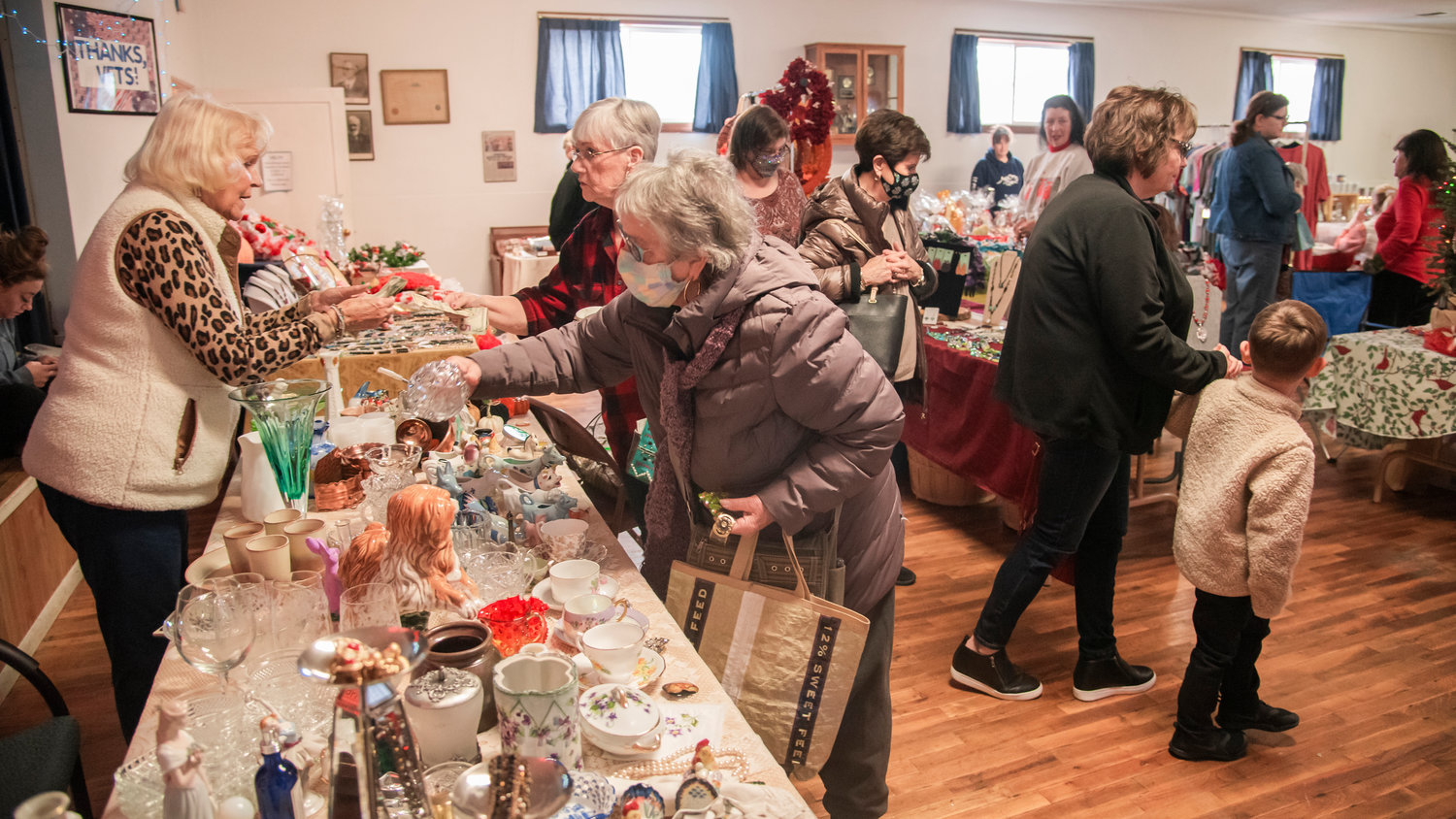 Yvonne John helps attendees purchase knick-knacks and other items on display at a Fall Bazaar and Lunch held at the Adna Grange Hall Saturday afternoon.