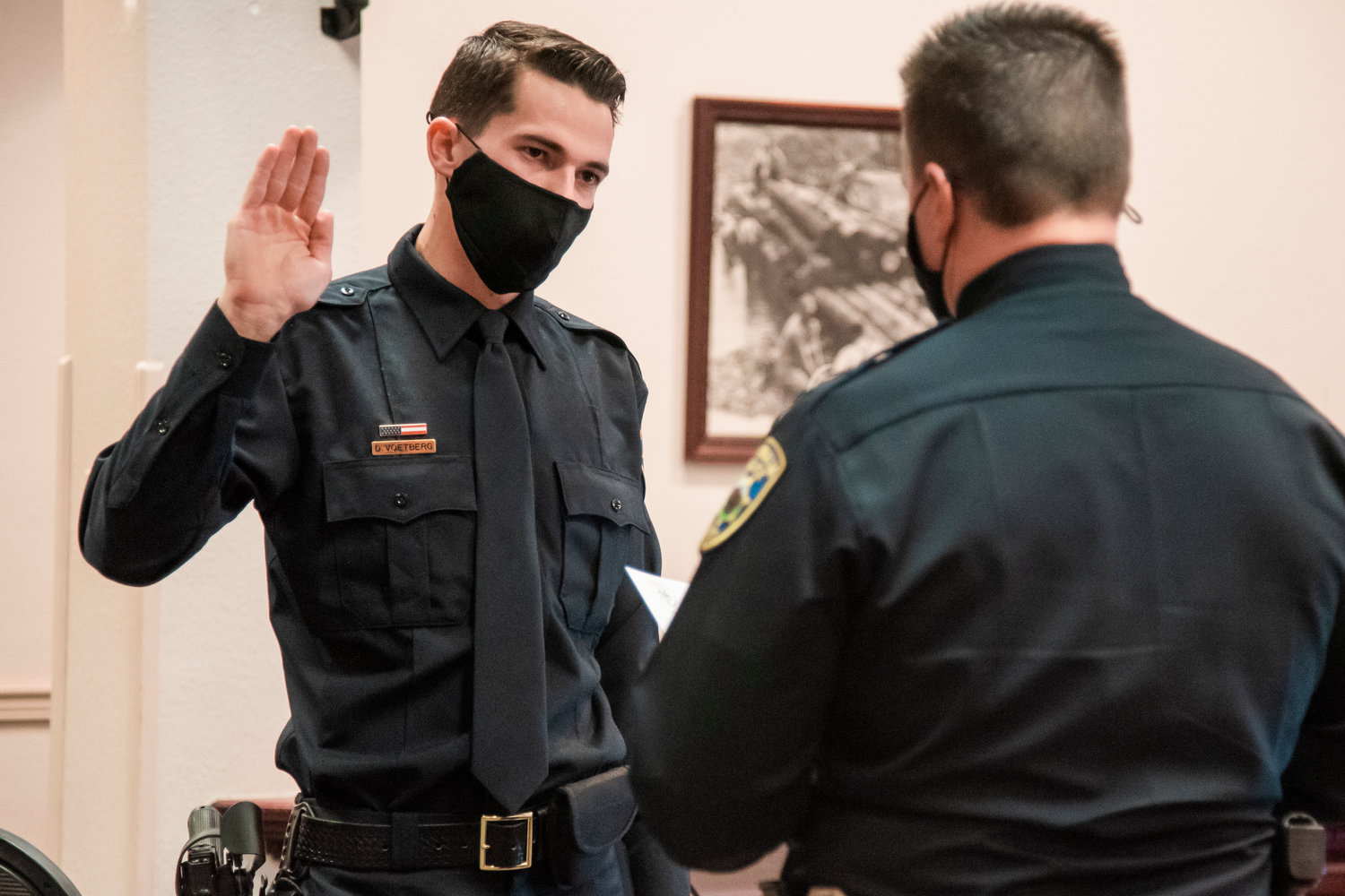Centralia native Deter Voetberg was sworn in Tuesday by Centralia Police Chief Stacy Denham as the city's newest police officer. A Centralia High School graduate, he wanted to become an officer "because he wanted to help the community that he was raised in and believes in," Denham said. He originally started his law enforcement career as a community service officer for the department. He graduated from police academy on Nov. 10, and now starts his field training. His father had the honor of pinning his badge.