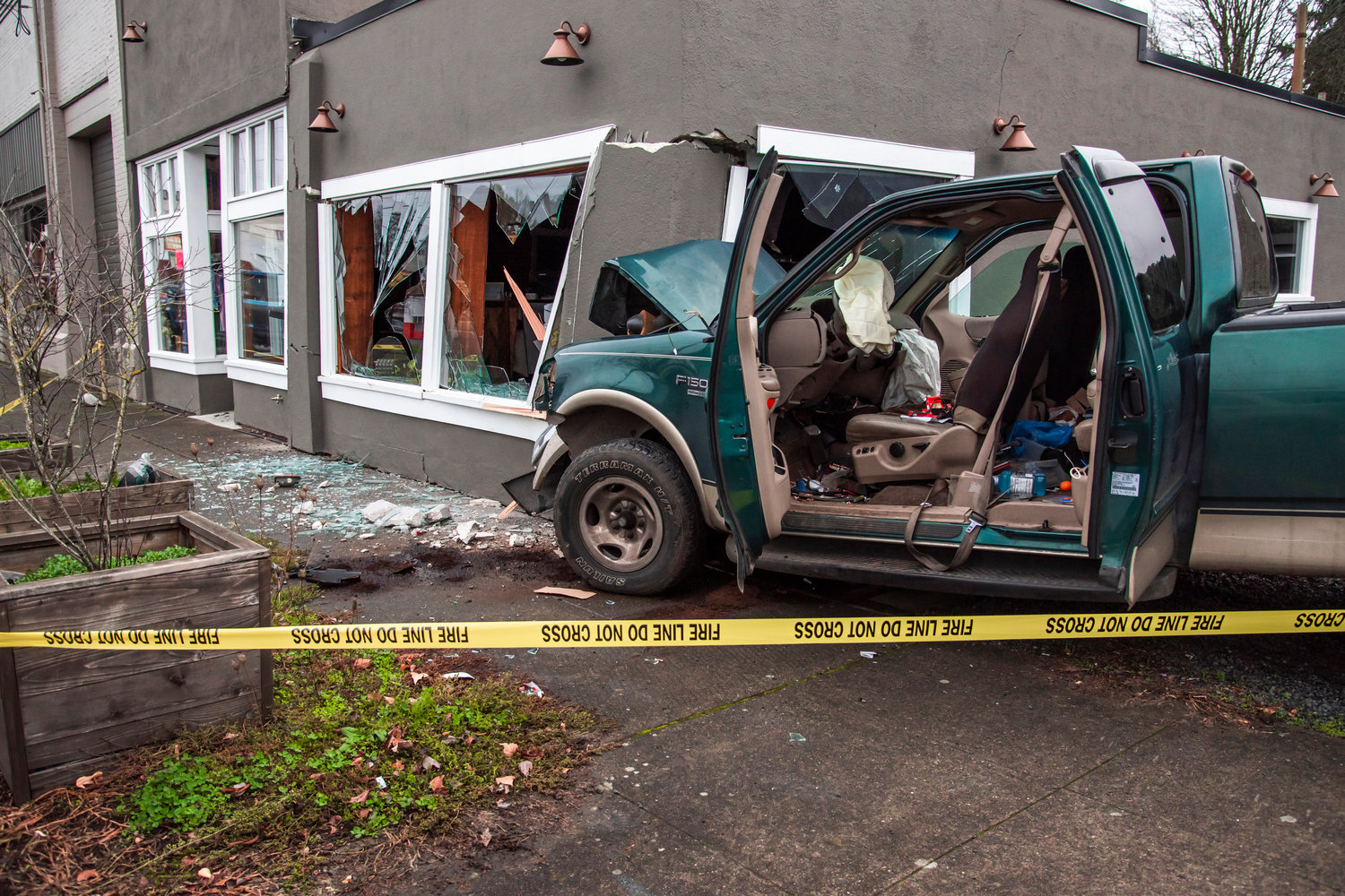 The scene of a crash is taped off after a vehicle drove into the Lash and Brow Company building along the 300 block of South Tower Avenue Saturday morning in Centralia.