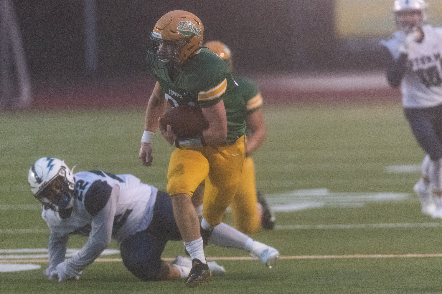 Tumwater tailback Payton Hoyt looks downfield with the ball against Squalicum in the 2A state semifinals Nov. 27.