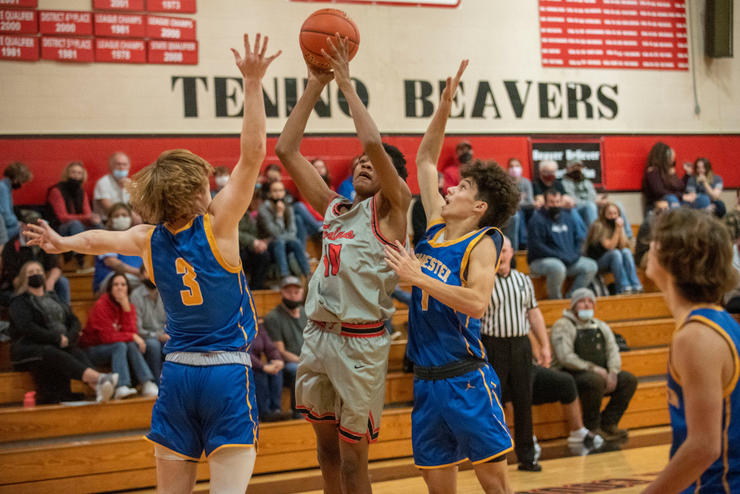 Tenino's Temaine Burras (10) shoots against a Rochester double team on Nov. 29.