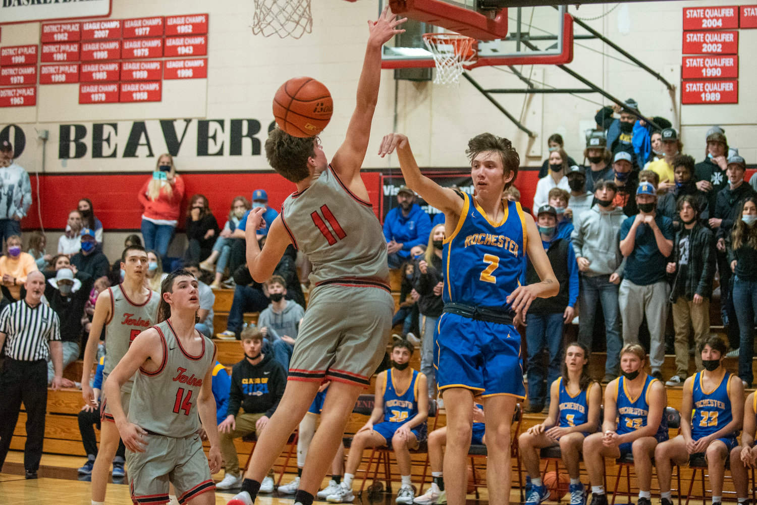 FILE PHOTO -- Rochester's Tyler Klatush (2) dishes off a pass under the hoops against Tenino on Nov. 29.