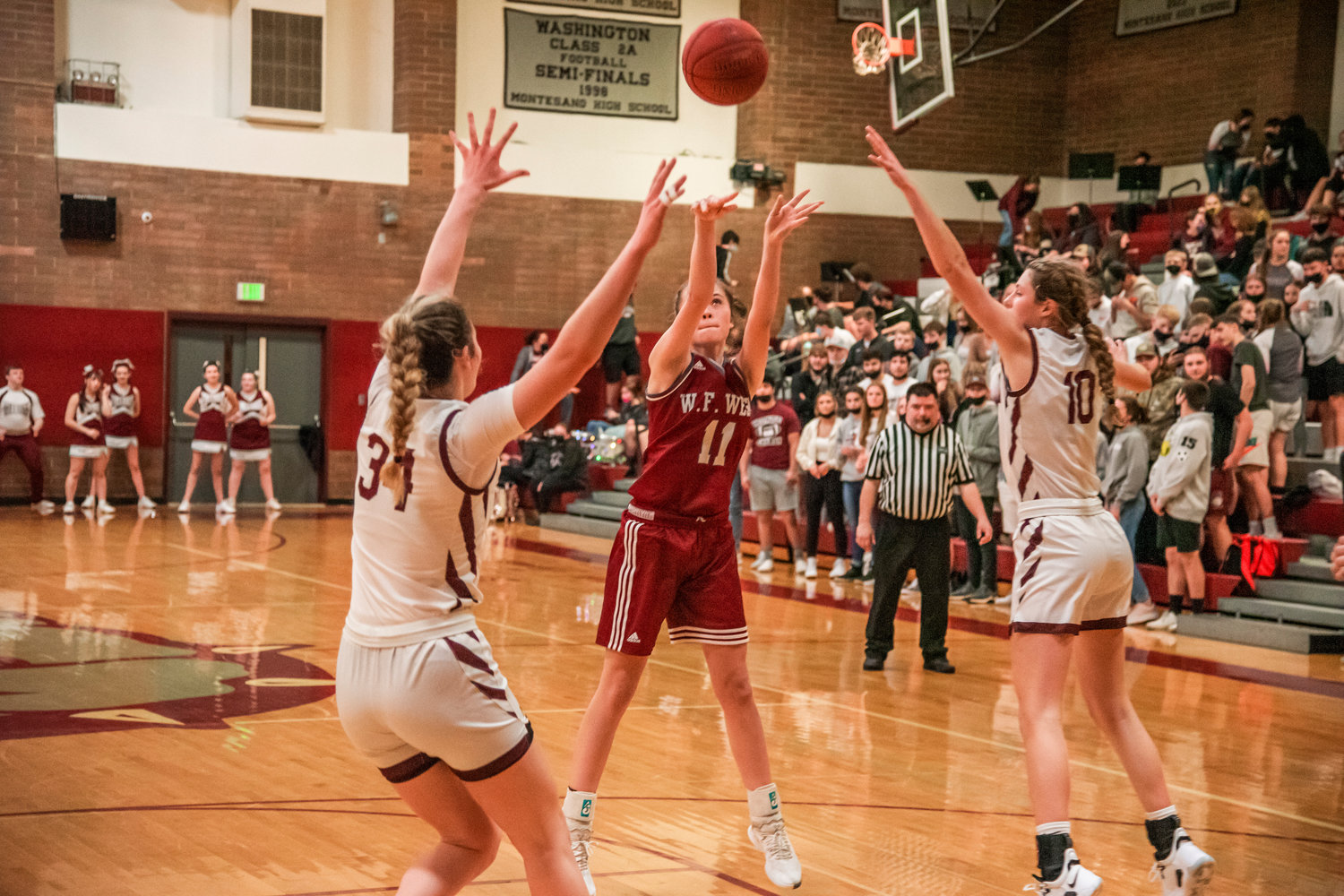 W.F. West’s Olivia Remund (11) puts up a shot during a game against Montesano Tuesday night.