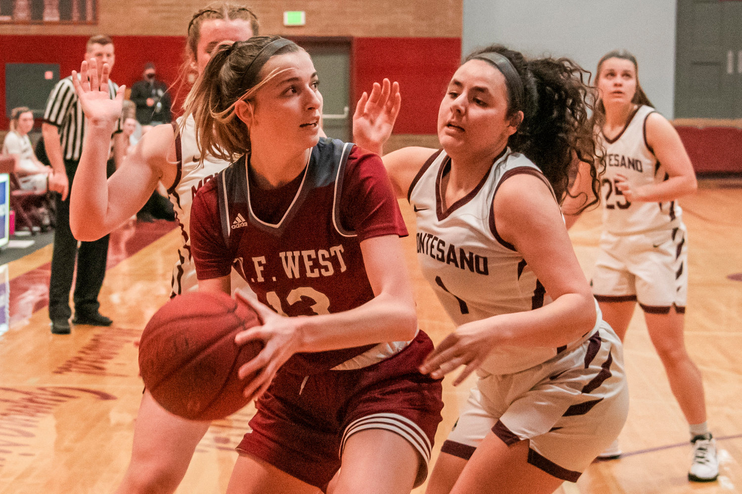 W.F. West’s Drea Brumfield (13) looks to pass while surrounded by Bulldog defenders in Montesano Tuesday night.