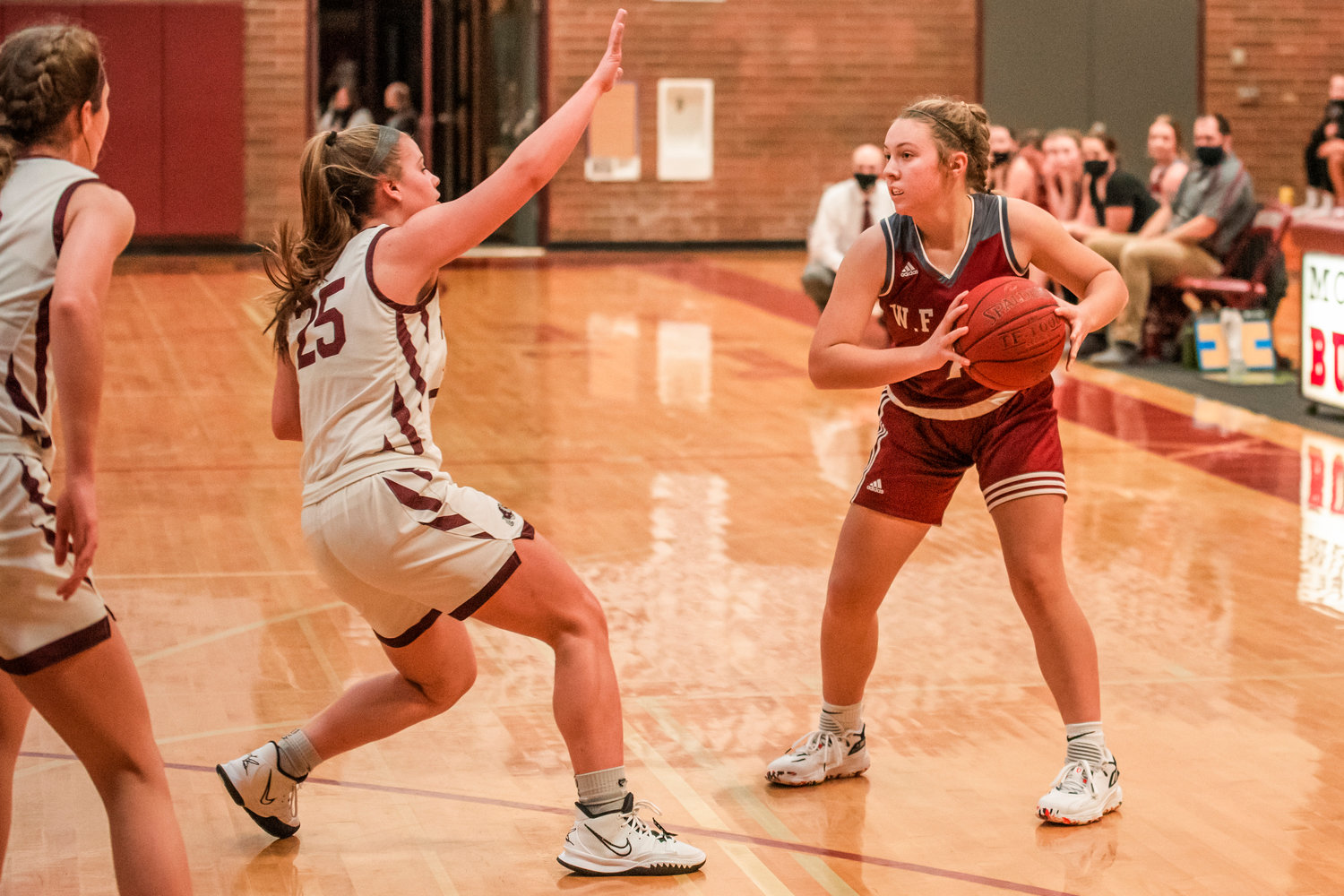 W.F. West’s Lena Fragner (1) holds the basketball during a game in Montesano Tuesday night.
