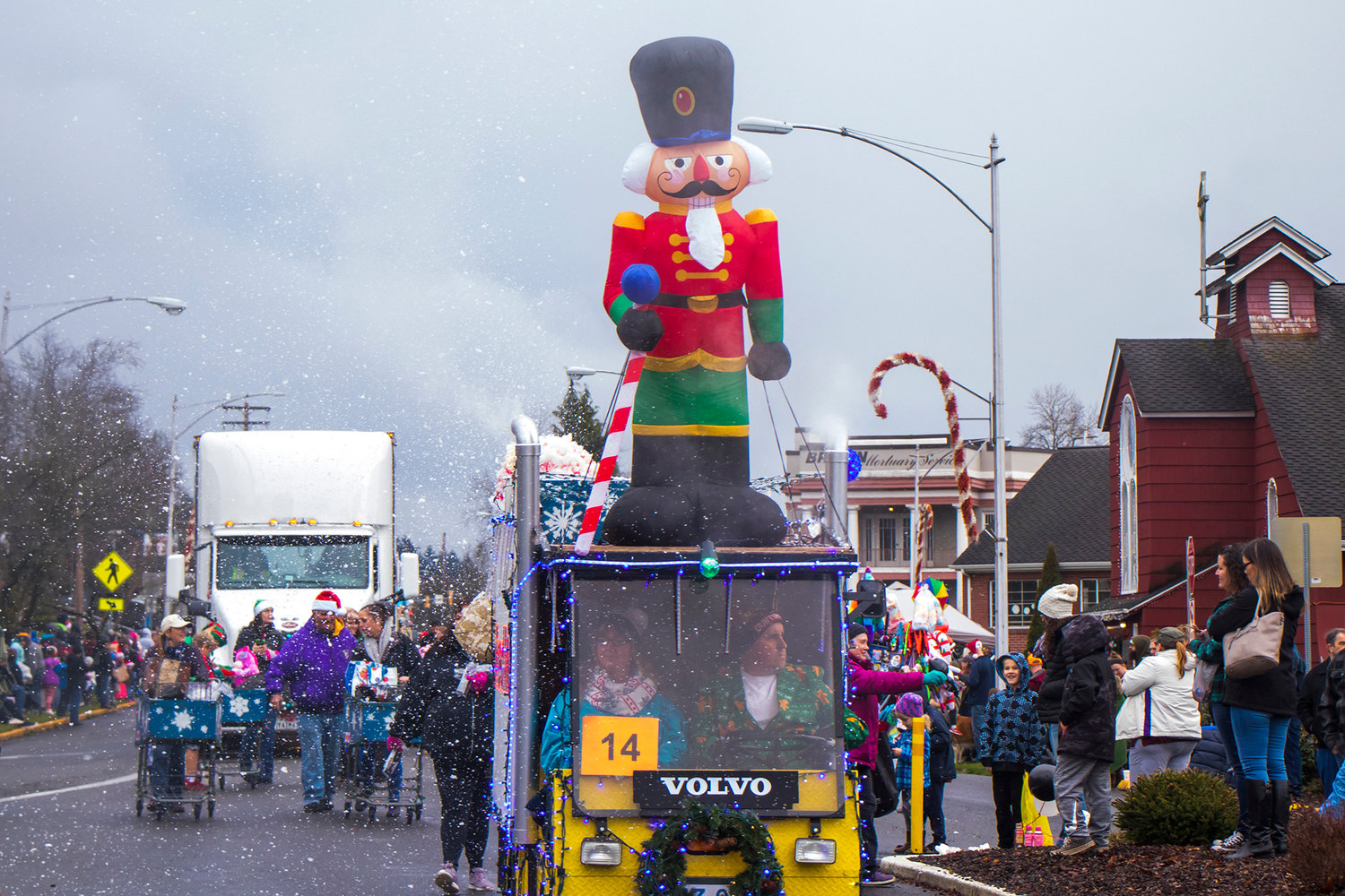 Fake snow rains down during the annual Santa Parade in downtown Chehalis in 2019.