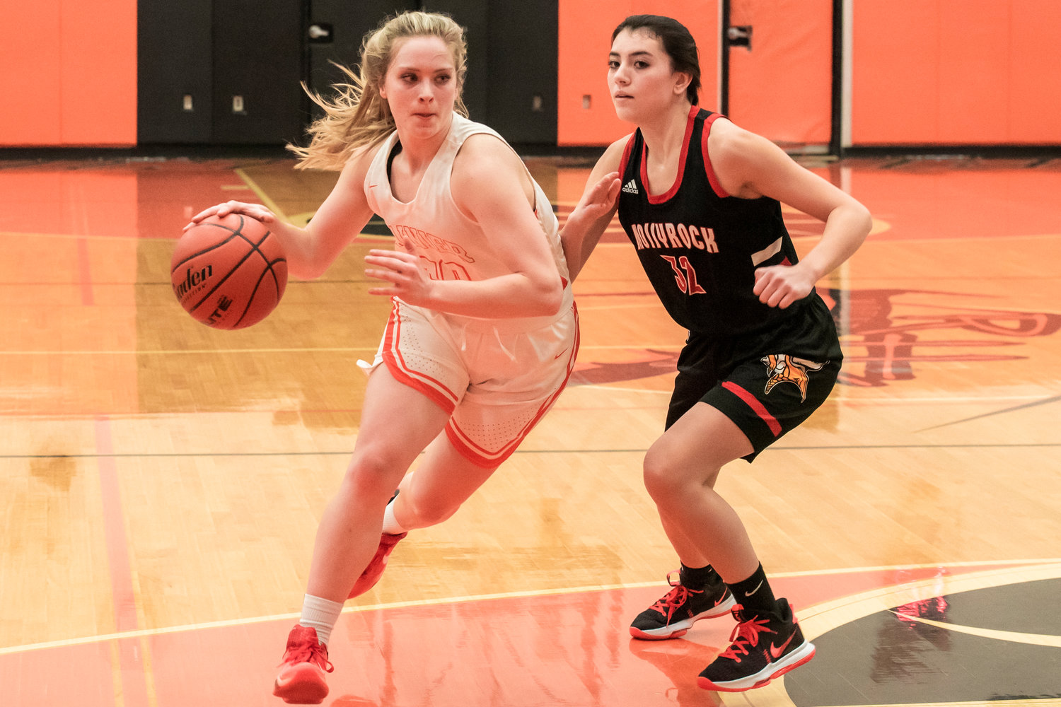 Rainier’s Isabella Holmes (30) drives towards the basket during a game against Mossyrock Thursday night.