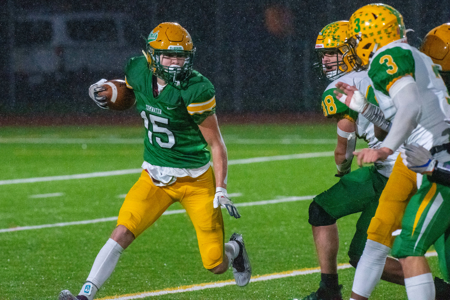 Tumwater’s Ashton Paine looks for running room against Lynden during the 2A state title game on Dec. 4.