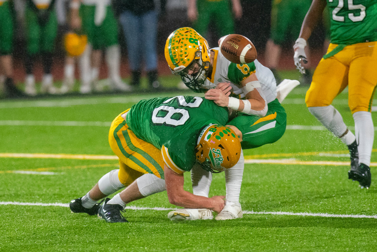 Tumwater’s Ryan Orr (28) delivers a hit to Lynden receiver Isaiah Stanley (8) during the 2A state title game on Dec. 4.