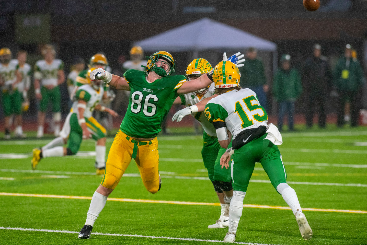 Tumwater’s Austin Terry (86) attempts to block a pass by Lynden’s Kaeden Hermanutz (15) during the 2A state title game on Dec. 4.