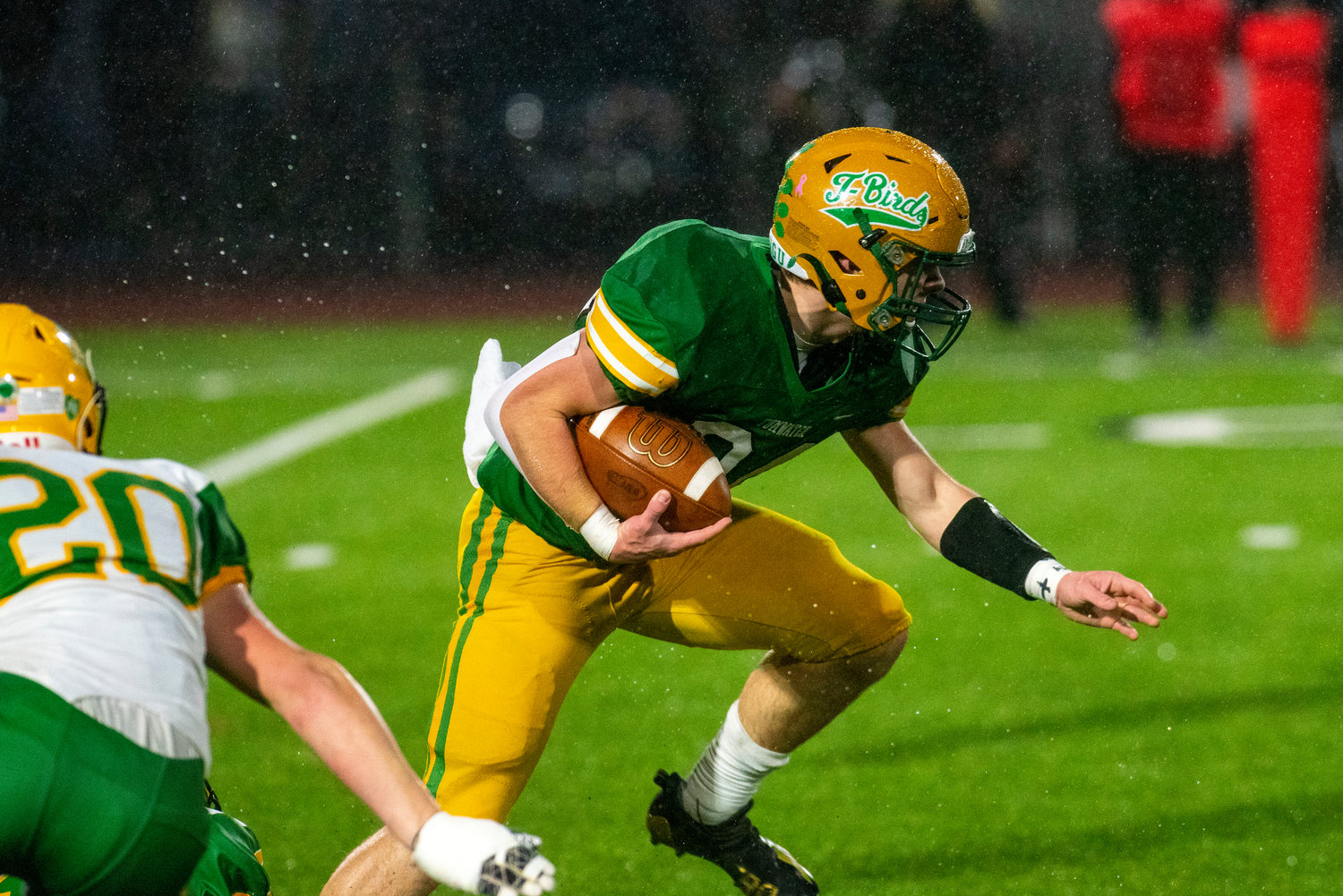 Tumwater’s Payton Hoyt looks for running room against Lynden during the 2A state title game on Dec. 4.