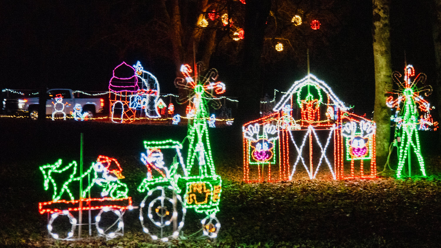 A truck drives through Fort Borst Park during a Christmas lights drive-through event on Friday, which was the opening night of the annual favorite.