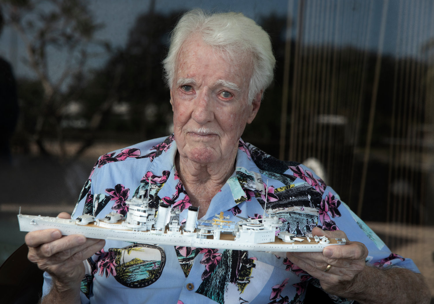 Stephen Cease, 88, holds a model of the USS New Orleans, 1939, in his St. Petersburg home Wednesday, November 17, 2021. Cease was 8 years old when he witnessed the bombing of Pearl Harbor. The USS New Orleans was one of the ships at Pearl Harbor at the time.