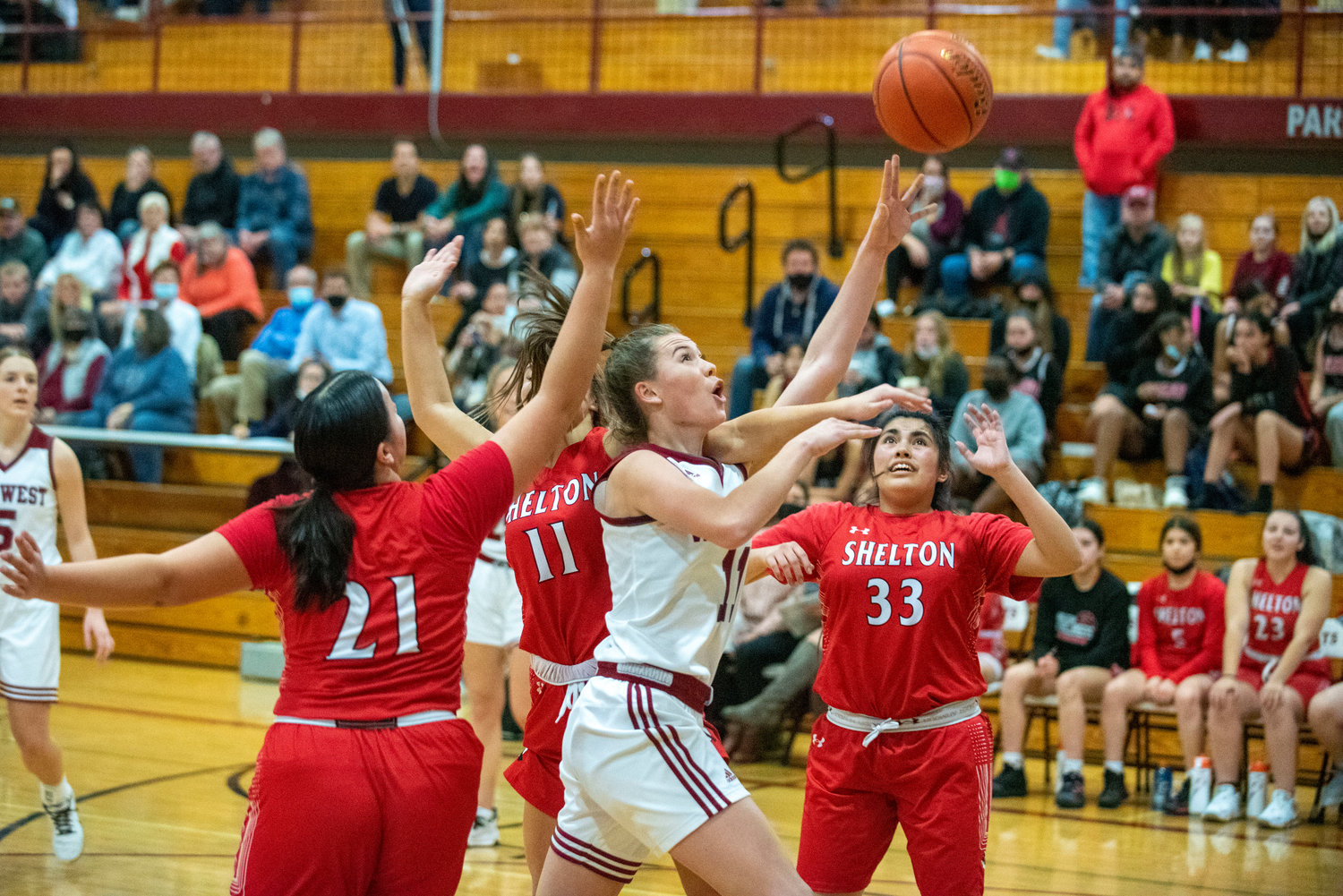 W.F. West's Olivia Remund (11) drives to the bucket against Shelton on Dec. 7