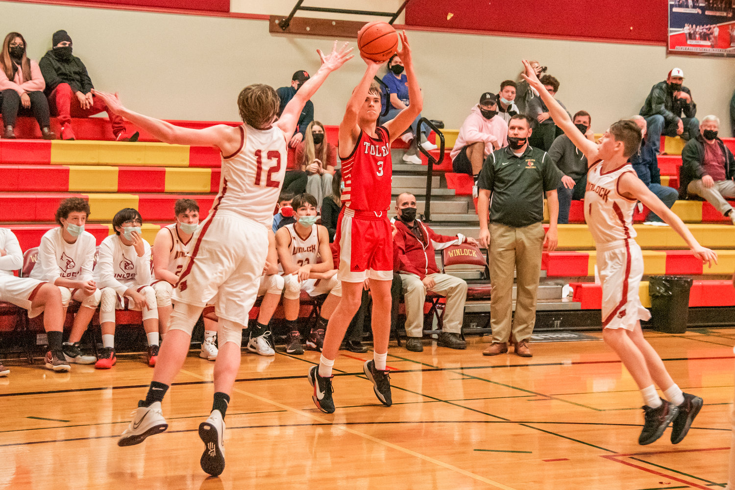 Toledo’s Rogan Stanley (3) puts up a three-point shot Tuesday night during a game against the Cardinals in Winlock.