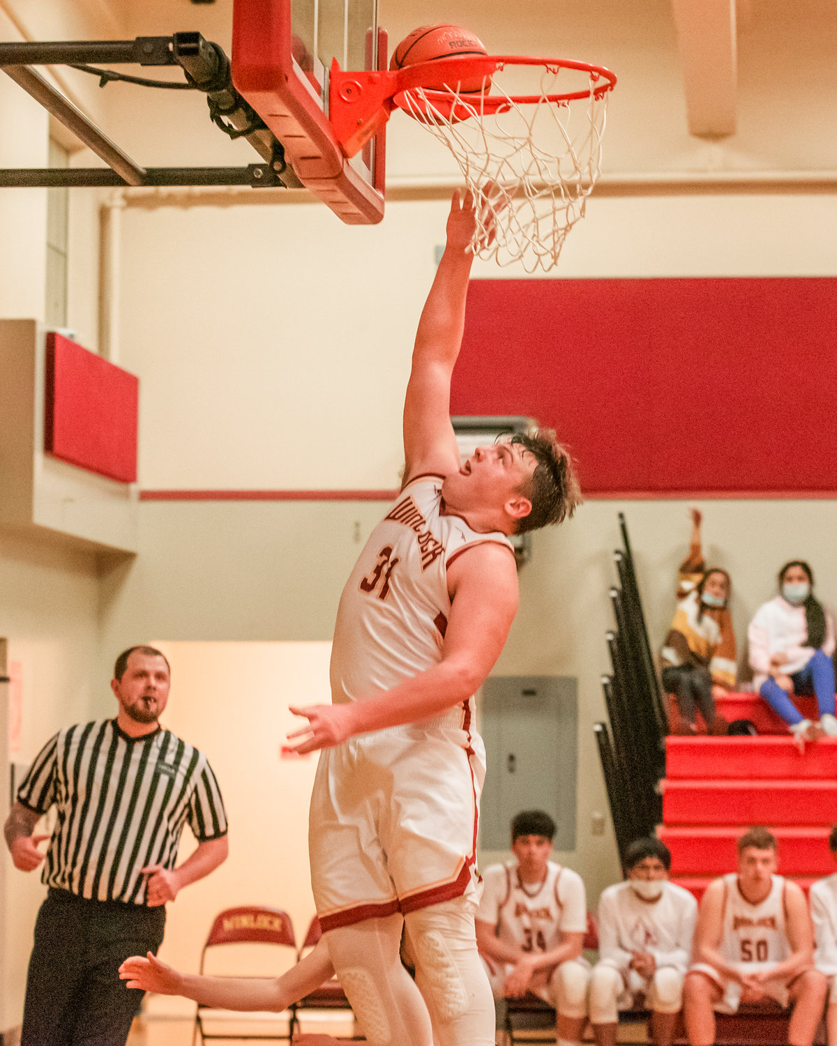 Winlock’s Nolan Swofford (31) puts up points Tuesday night during a game against Toledo.