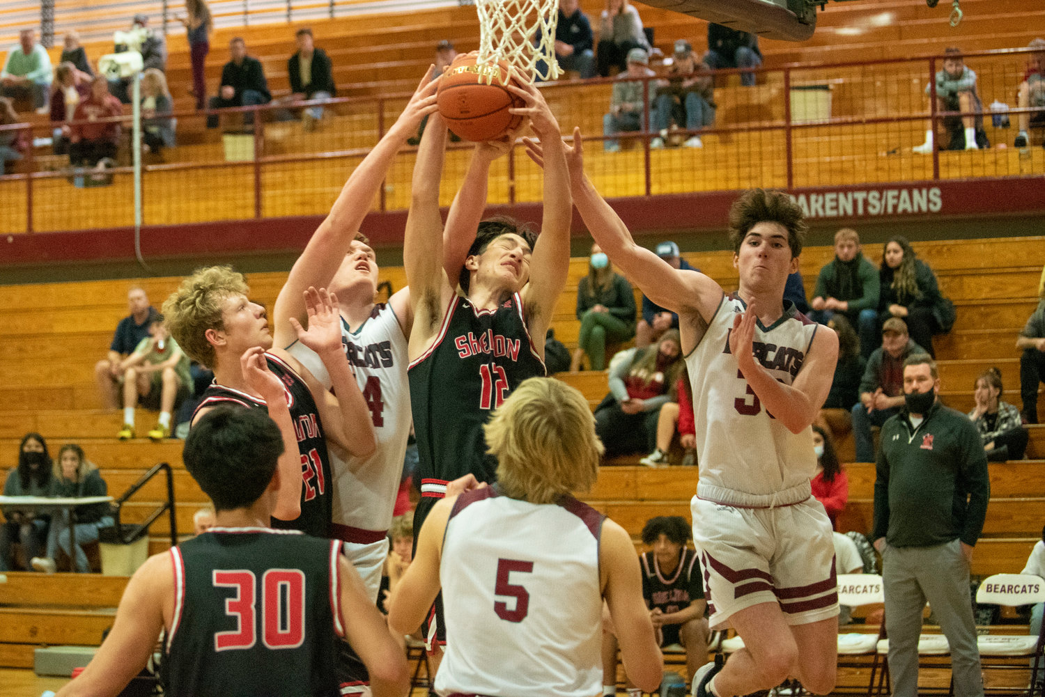 Shelton and W.F. West players battle for a rebound during a game in Chehalis on Dec. 8.