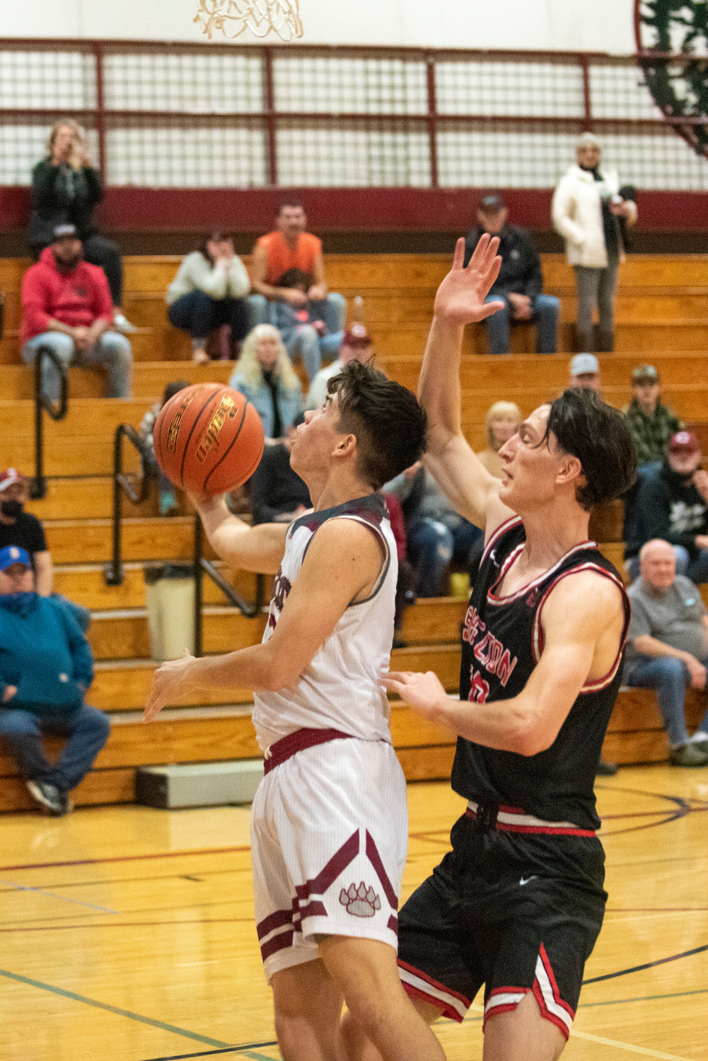W.F. West's Cameron Amoroso throws up a reverse layin against Shelton on Dec. 8.