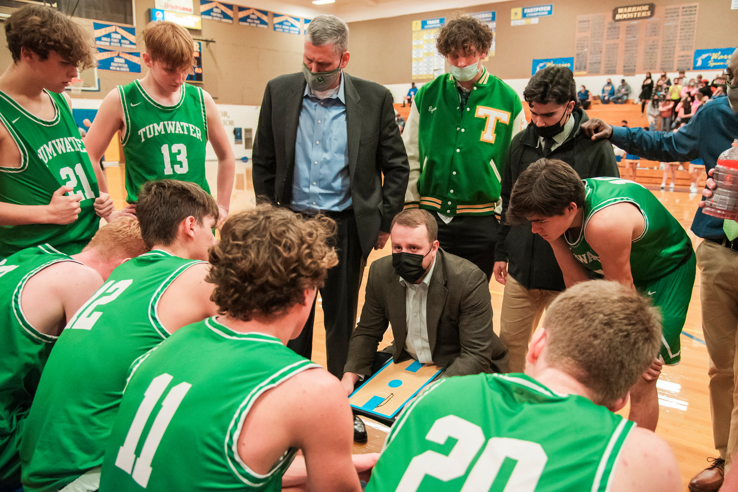 Tumwater Head Coach Josh Wilson talks to athletes during a game Wednesday night in Rochester.