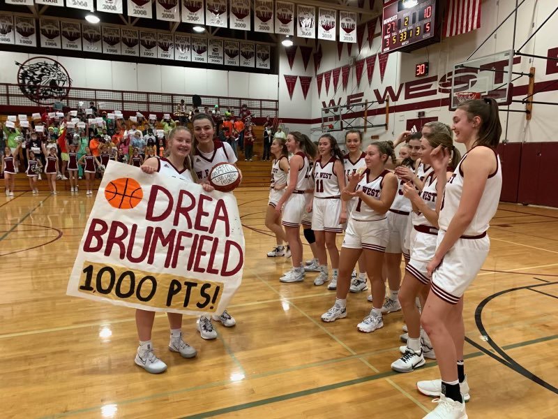 Drea Brumfield poses with a game ball and poster after scoring her 1,000th career point in a W.F. West win over Aberdeen Dec. 9. Brumfield is the third Bearcat in program history to reach the milestone.