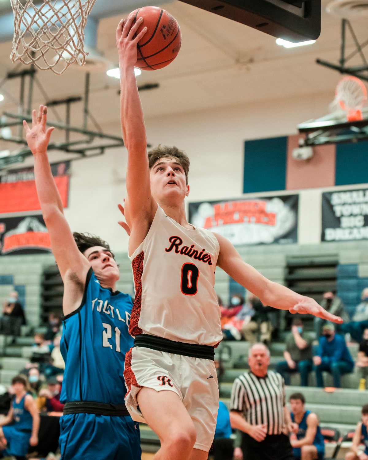 Rainier’s Ian Sprouffske (0) goes up with the ball to score during a game Thursday night.