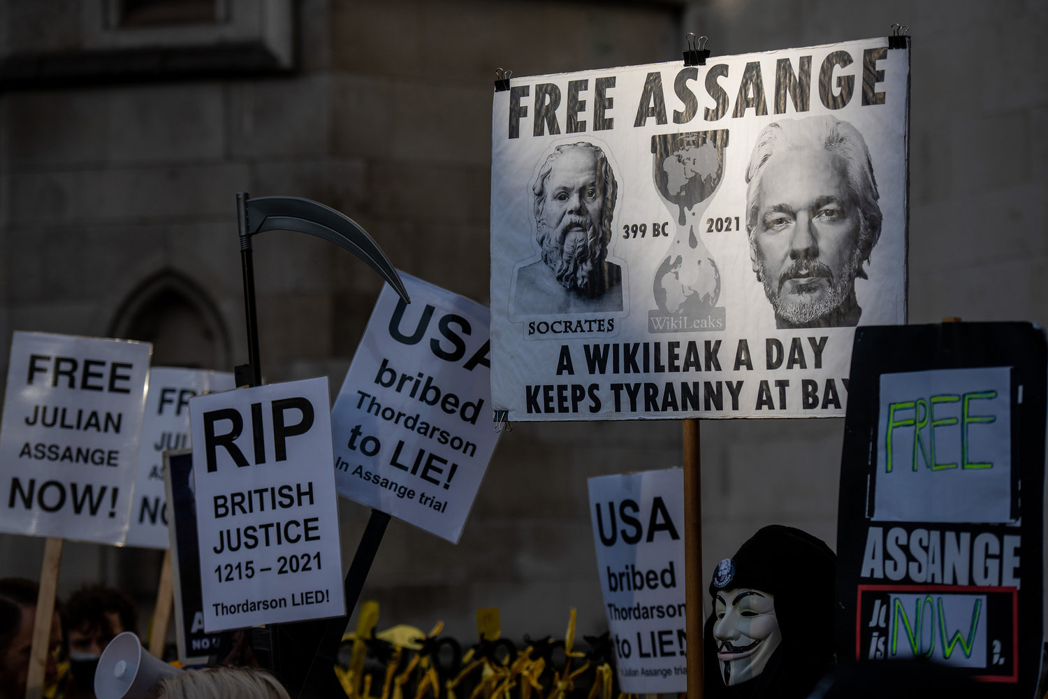 Supporters of Julian Assange react as the judgement is announced outside the Royal Courts of Justice on Friday, Dec. 10, 2021 in London, England. The High Court ruled that Assange can be extradited to the United States, where he is charged with hacking and other crimes. The ruling overturned a January ruling by a district court judge that Assange should not be extradited due to his mental state. The Wikileaks founder has been imprisoned since 2019, following seven years living in the Ecuadorian embassy in London, where he was avoiding extradition to Sweden on unrelated charges. (Chris J Ratcliffe/Getty Images/TNS)