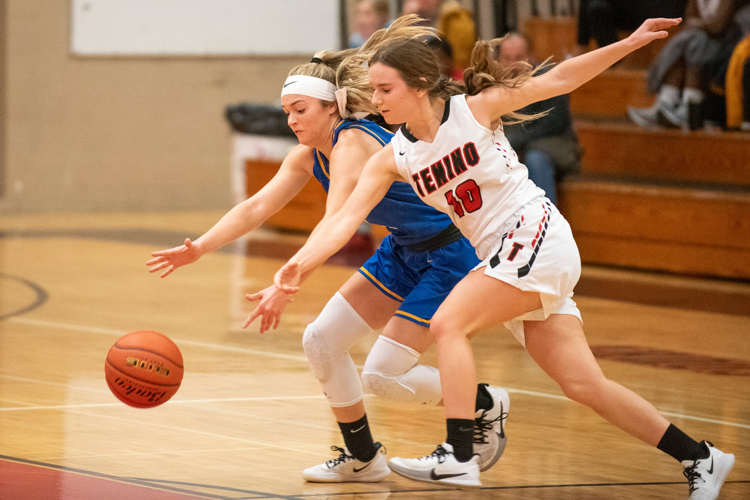 Tenino's Grace Vestal (10) and Adna's Kaylin Todd battle for a loose ball on Dec. 14.