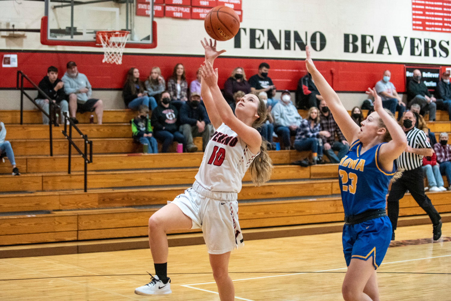 Tenino's Grace Vestal (10) throws up a layin against Adna's Kendall Humphrey (23) on Dec. 11.