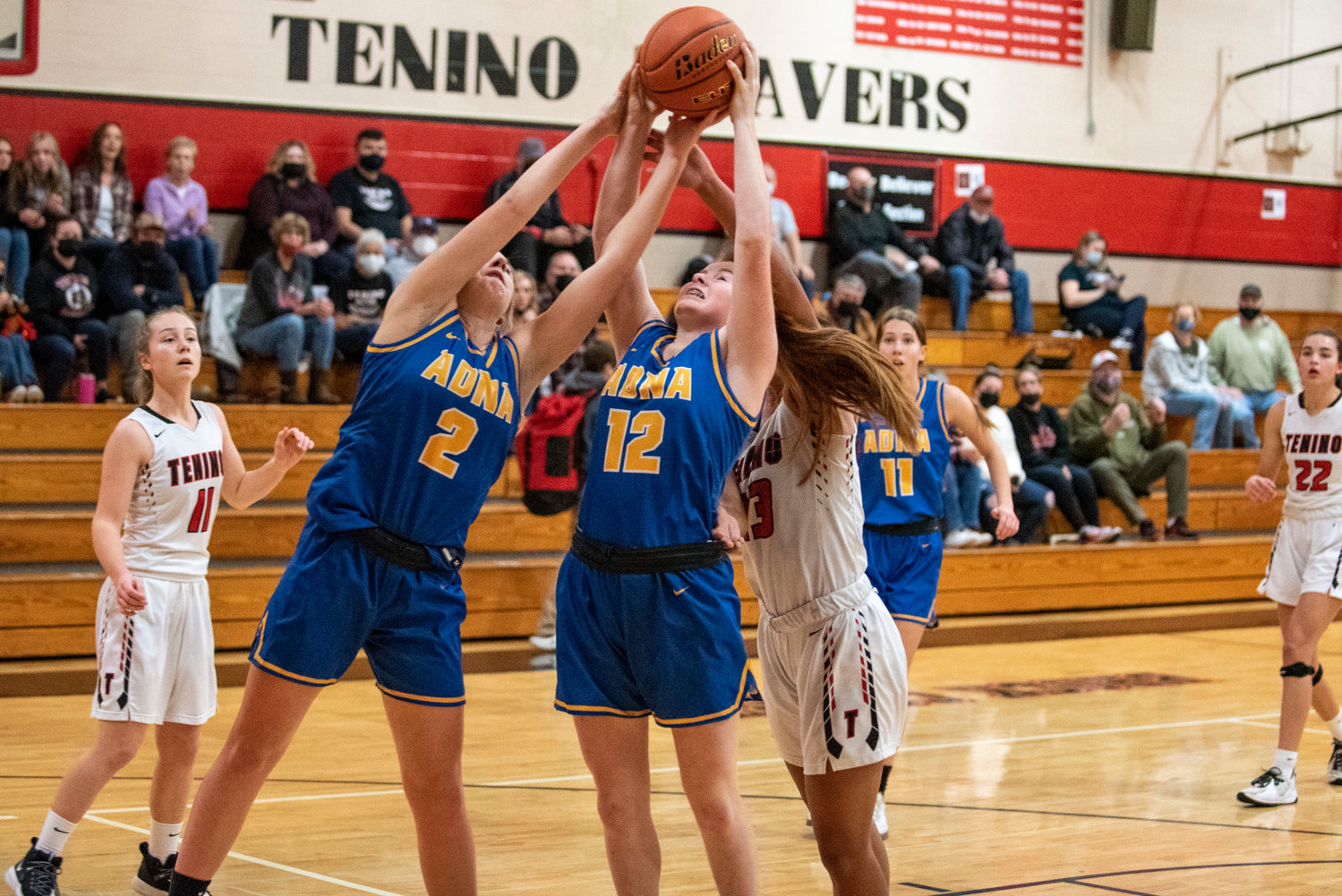 Adna's Summer White (2) and Natalie Loose (12) go for a defensive rebound against Tenino on Dec. 14.