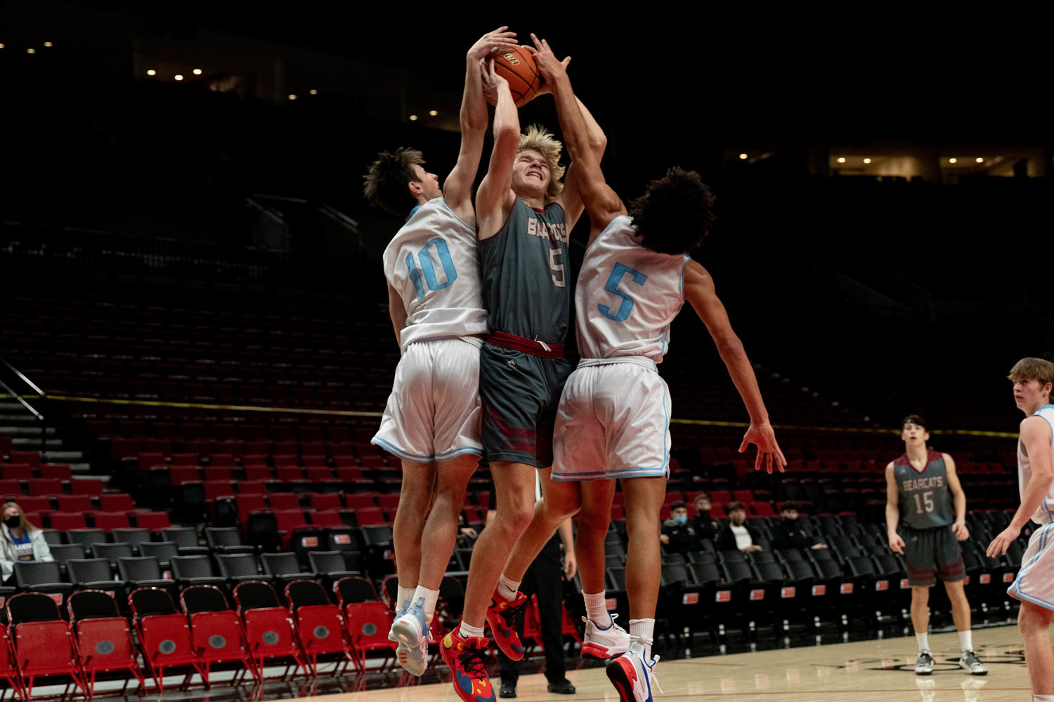 W.F. West's Dirk Plakinger is blocked attempting a jump shot against Mark Morris at the Moda Center in Portland Dec. 11.