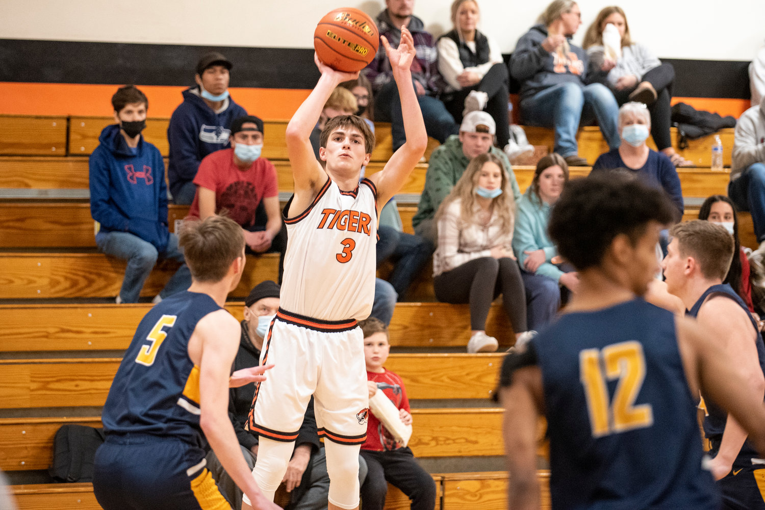 Napavine's James Grose (3) shoots a 3-pointer during the TIgers' season opener at home against Aberdeen on Dec. 11.