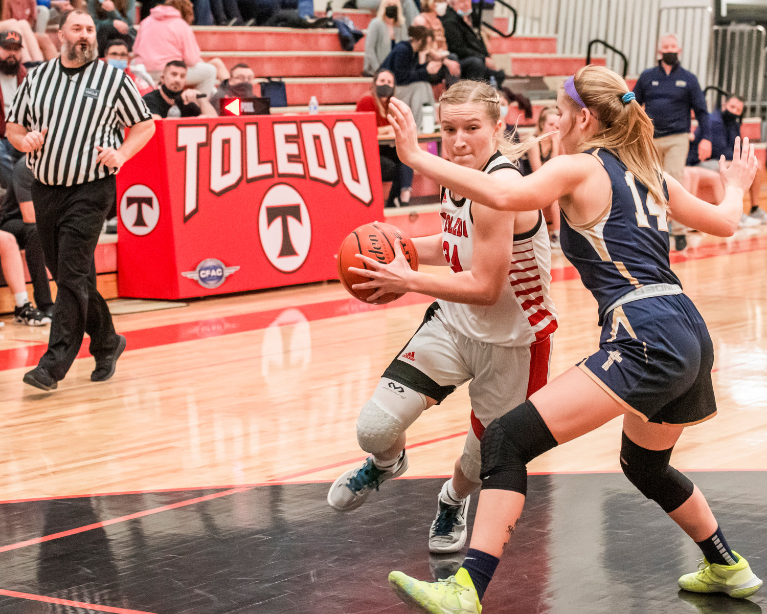 Toledo’s Greenlee Clark (24) drives in with the ball during a game Saturday night.