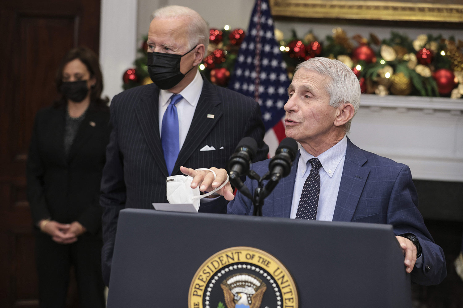 Dr. Anthony Fauci, chief medical adviser to the president, right, joined by U.S. President Joe Biden, center, and Vice President Kamala Harris, left, speaks on the omicron variant in the Roosevelt Room of the White House in Washington, D.C., on Nov. 29, 2021. (Oliver Contreras/Pool/ABACAPRESS.COM/TNS)