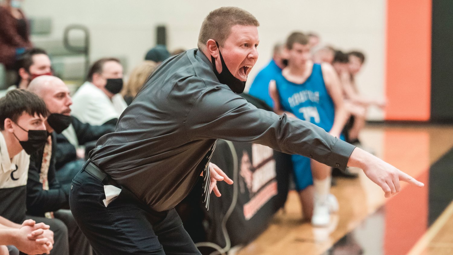 Rainier Head Coach Ben Sheaffer yells to players on the court during a game against Toutle Thursday night.