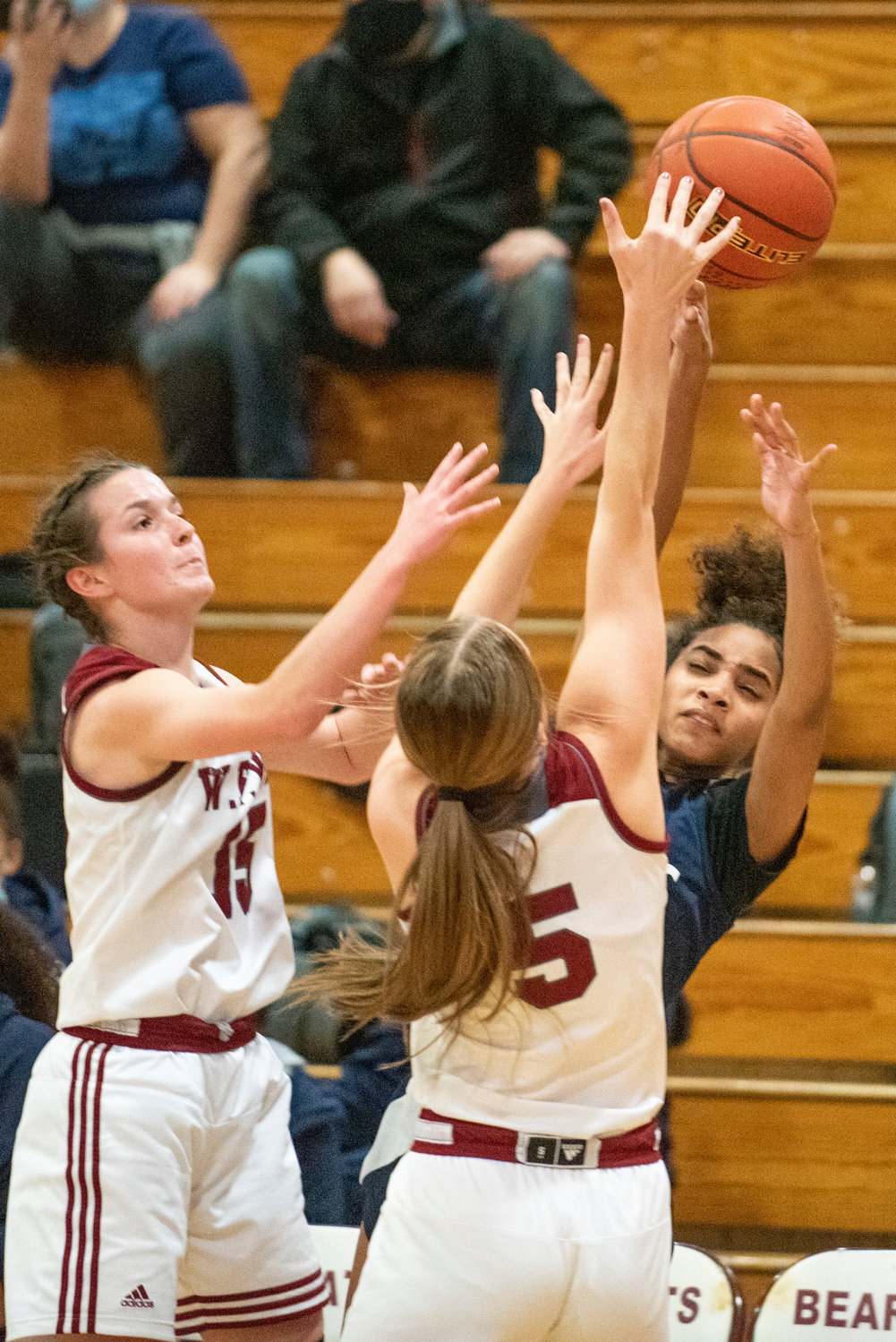 W.F. West's Mak Mencke (5) stuffs a pass attempt by River Ridge by Amanda Bennett (15) helps with the trap on Dec. 14.