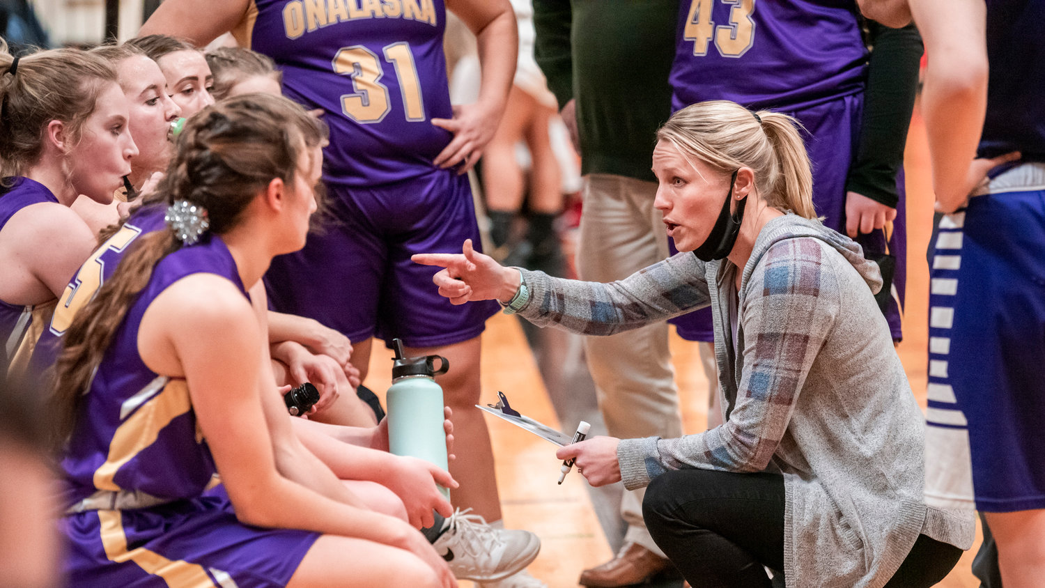 Onalaska Head Coach Alana Olson talks to athletes during a game in Mossyrock Wednesday night.