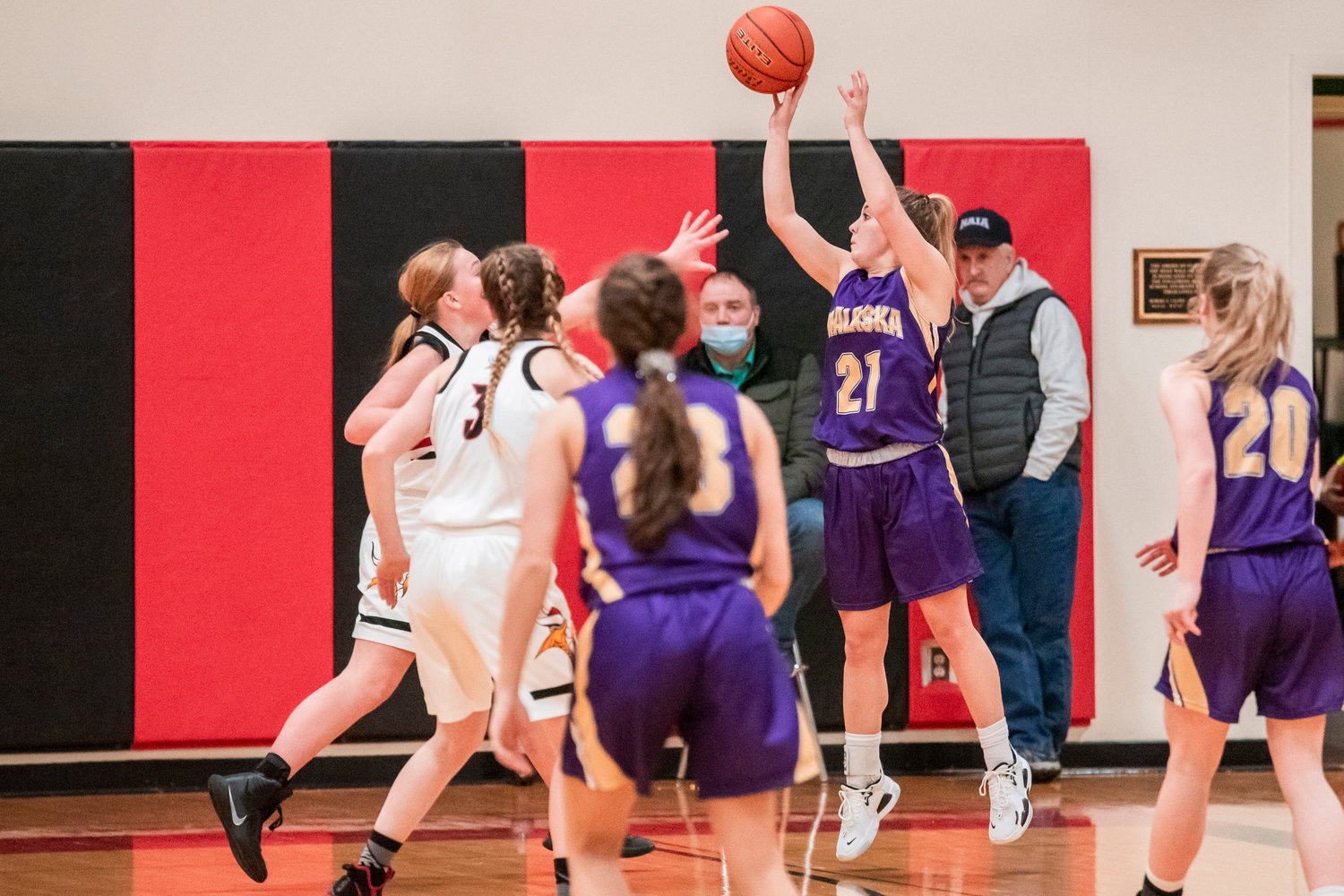 Onalaska’s Callie Lawrence (21) puts up a three-point shot Wednesday night at Mossyrock High School.