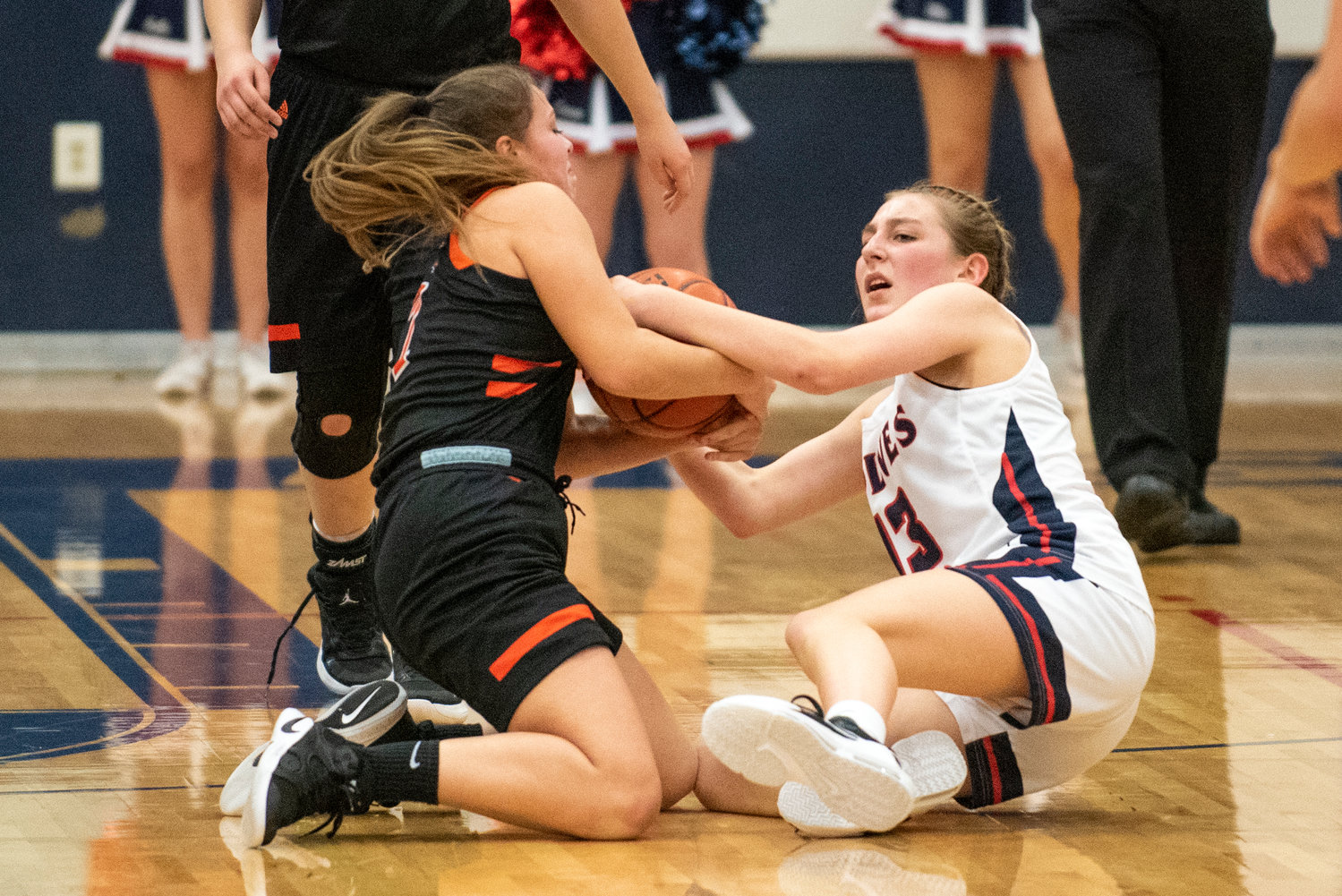 Centralia's Jadyn Hawley, left, and Black Hills' Claire Johnson battle for a loose ball on Dec. 17.