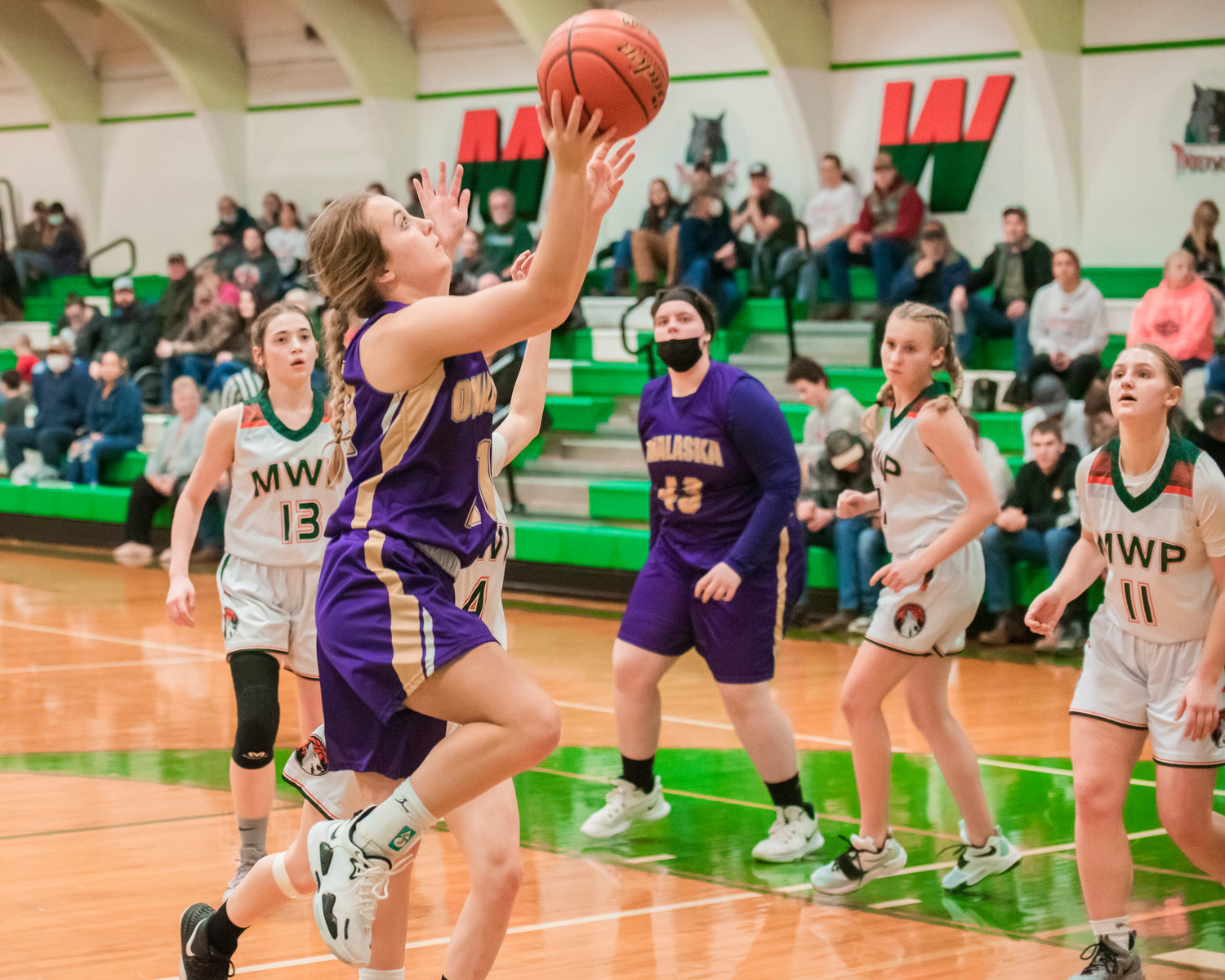Onalaska’s Callie Lawrence (21) goes up with the ball during a game Saturday in Morton.