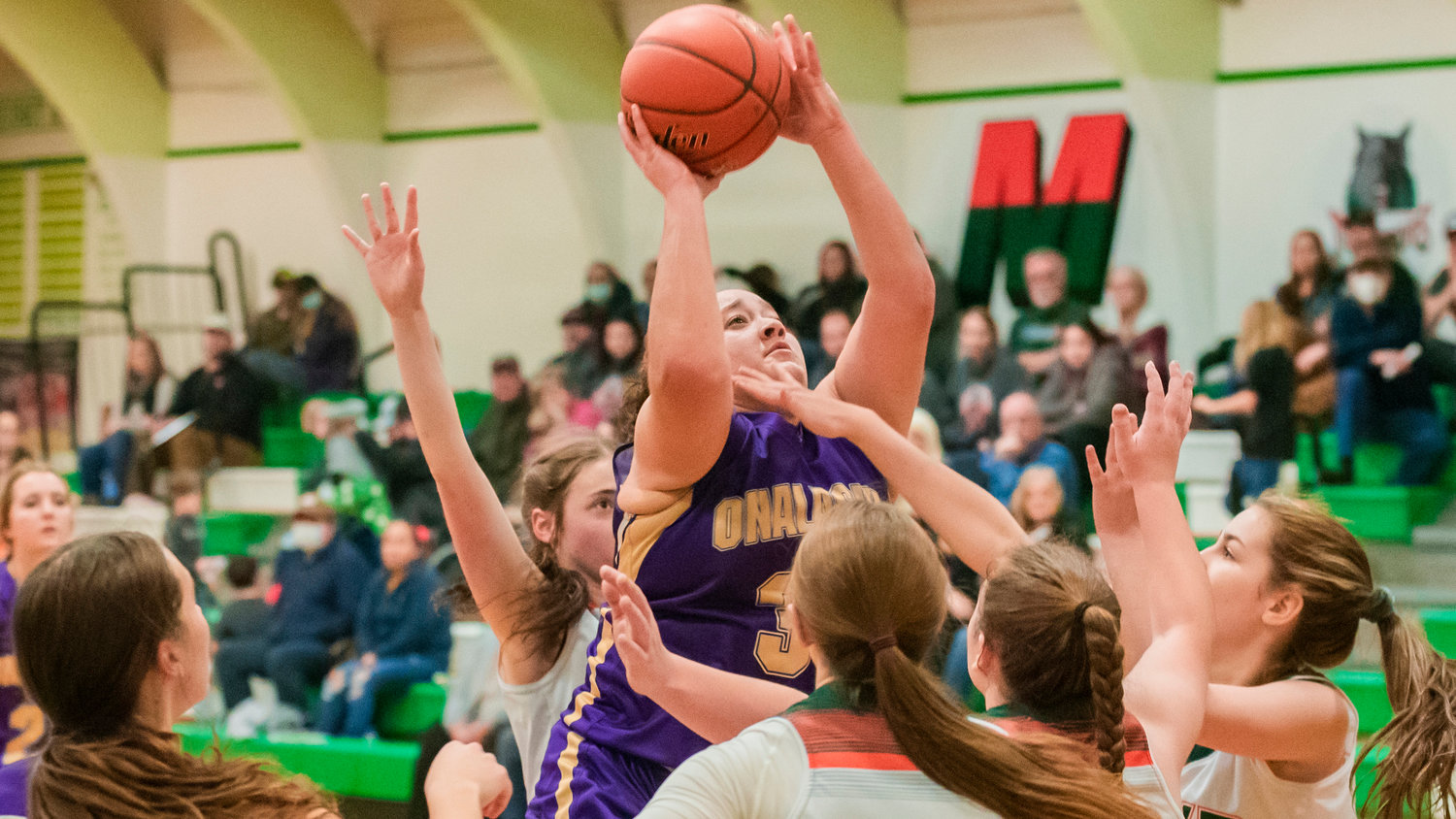Onalaska’s Alex Cleveland-Barrera (31) shoots over Timberwolves during a game Saturday night in Morton.