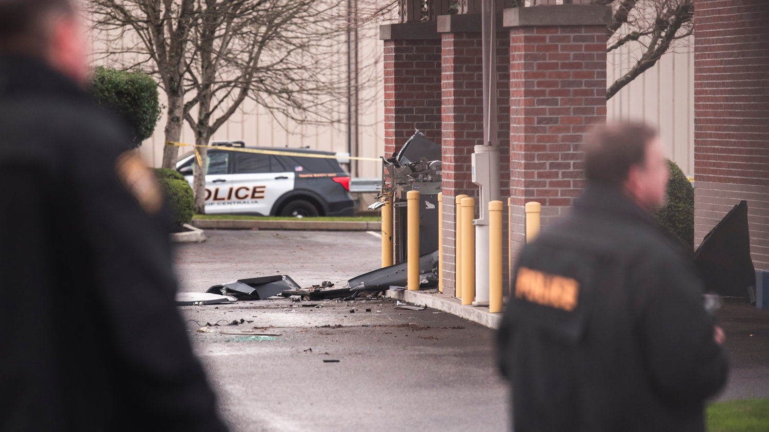 Debris is seen scattered in an area where an ATM once stood outside the 1st Security Bank in Centralia after reports of an explosion in the area last month.